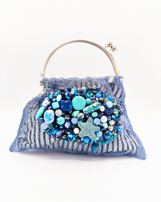 Pochette de acero azul